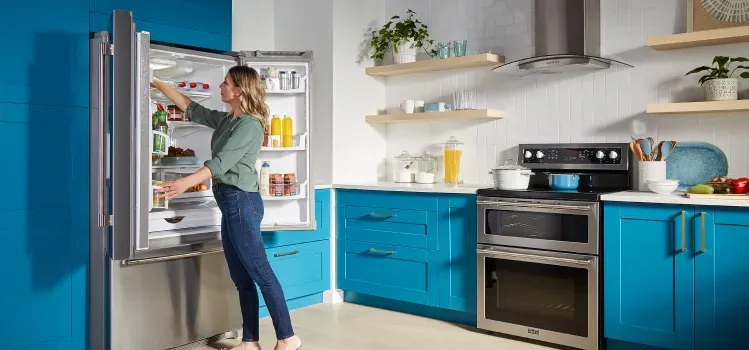 woman-opening-maytag-french-door-refrigerator-MFI2570FEZ